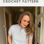 Woman wearing a short-sleeve, light gray crochet sweater standing in a doorway; text above reads "easy sweater CROCHET PATTERN.