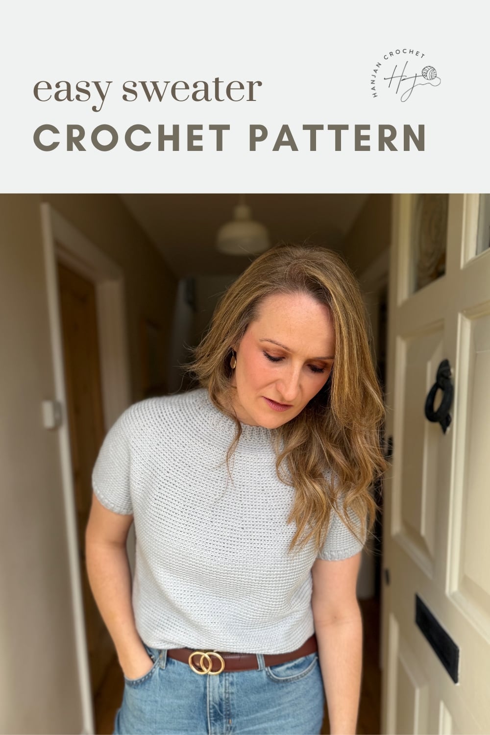 Woman wearing a short-sleeve, light gray crochet sweater standing in a doorway; text above reads "easy sweater CROCHET PATTERN.