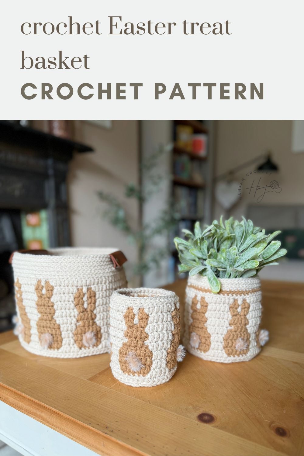 Three cream-colored crochet bunny baskets with brown designs are displayed on a wooden table; one holds a green plant. Text above reads "crochet Easter treat basket CROCHET BUNNY BASKET PATTERN.