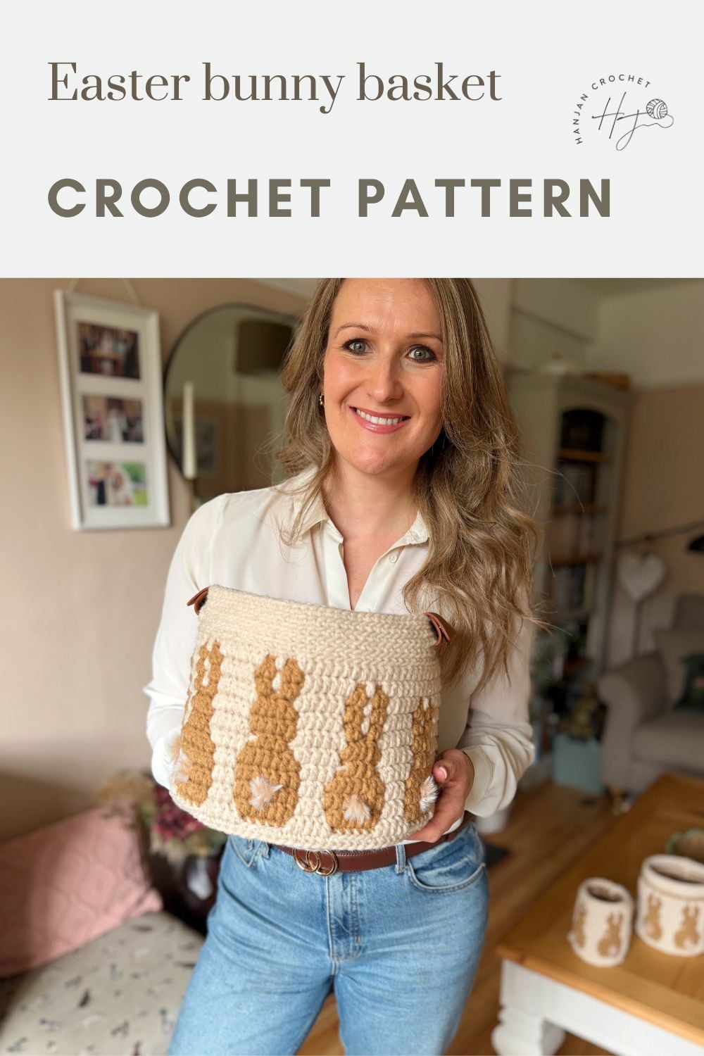 A woman stands indoors holding a crochet bunny basket pattern featuring a brown bunny design, with text above that reads "Easter bunny basket CROCHET PATTERN.