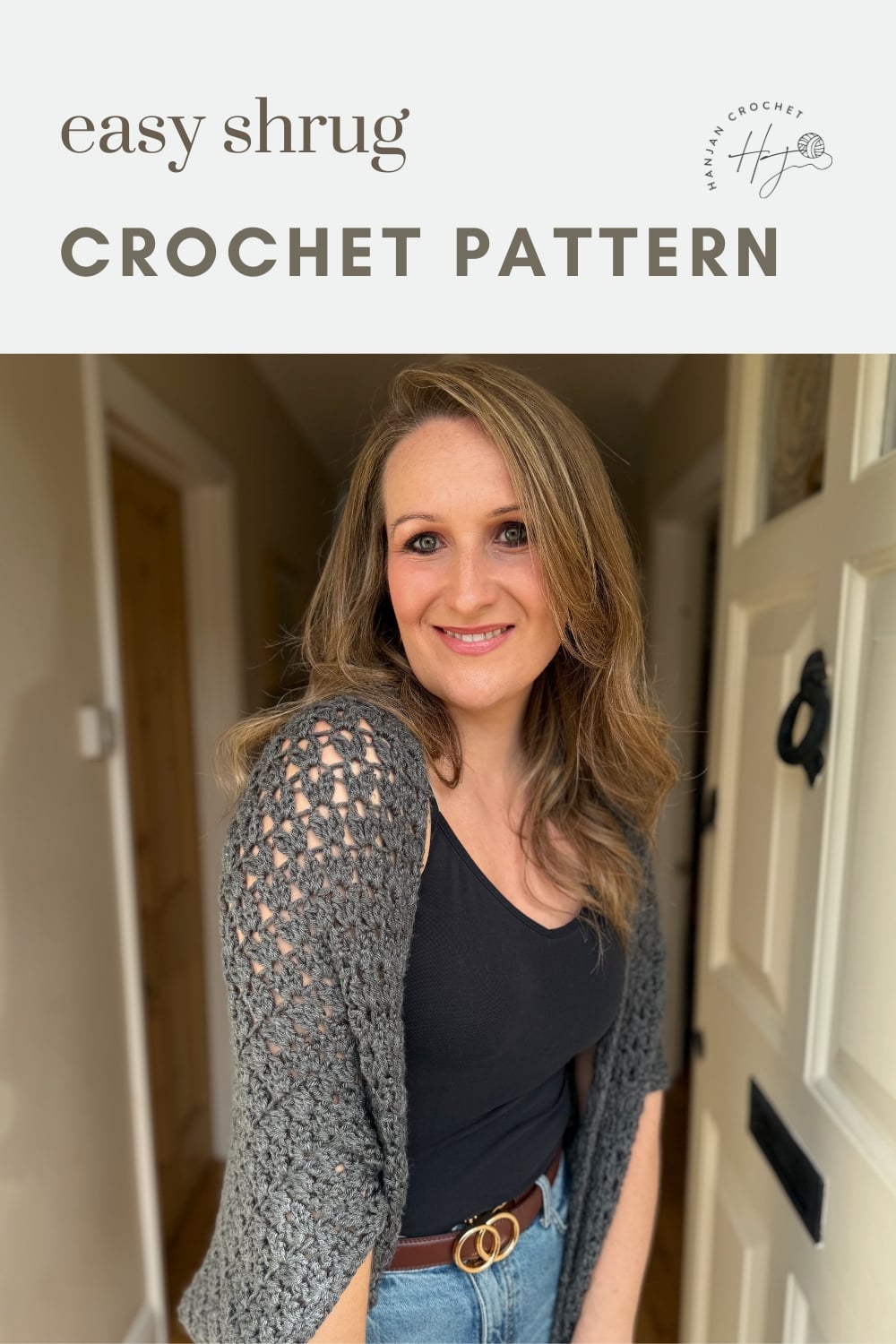 Woman wearing a gray crocheted shrug over a black top and jeans stands near an open door; text above reads "easy shrug CROCHET PATTERN.