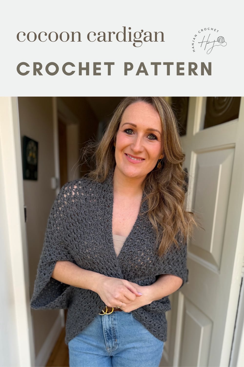 A woman stands in a doorway wearing a grey crocheted cocoon cardigan. The text above reads "cocoon cardigan CROCHET PATTERN" with a small crochet logo.