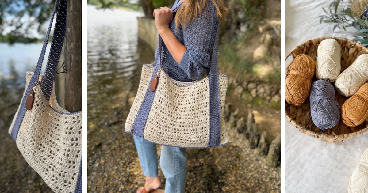 A person holds a crocheted tote bag with cream and blue yarn by a lakeshore; nearby, balls of yarn in beige, blue, and brown are displayed in a woven basket—perfect inspiration for a free crochet beach bag pattern.