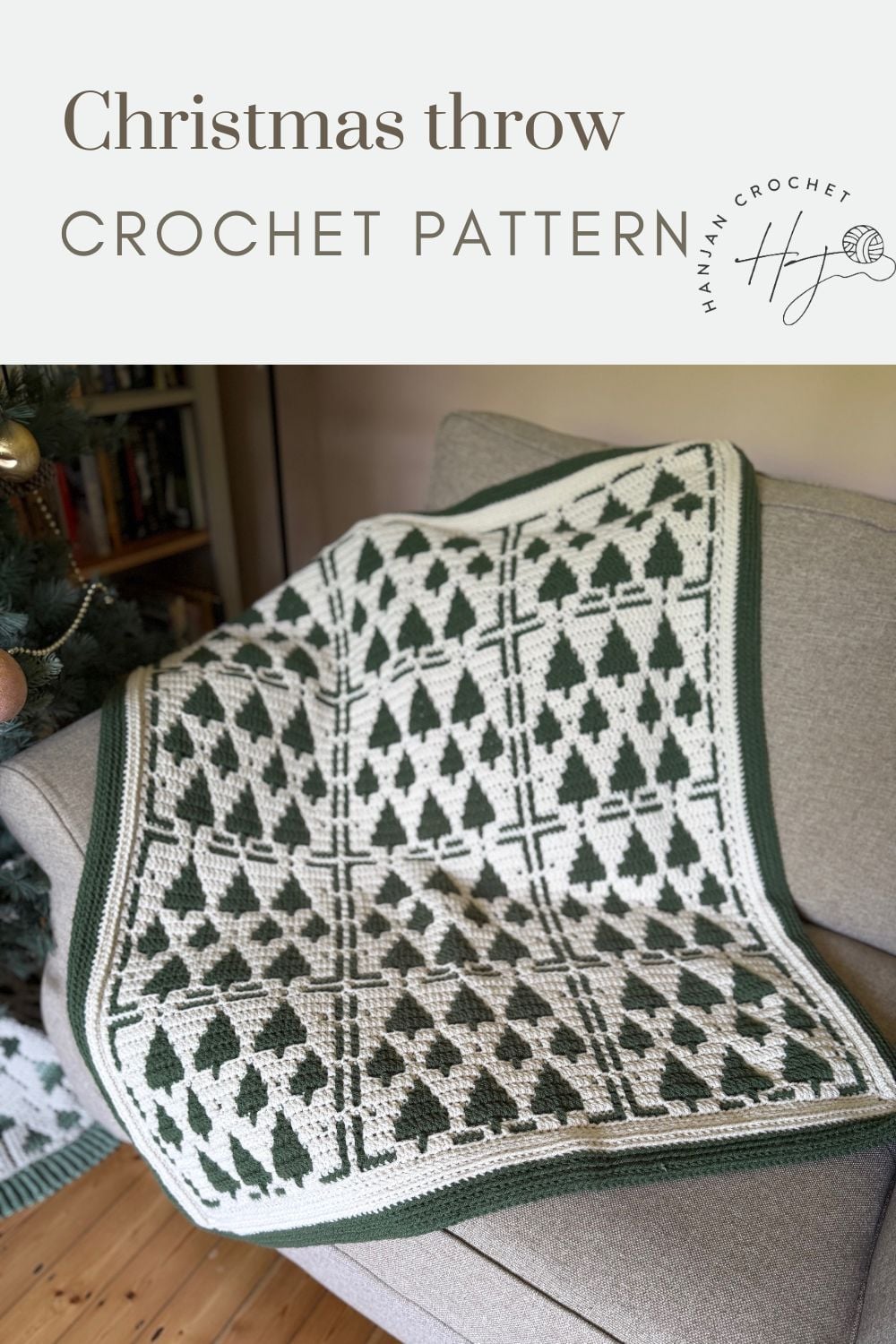 Green and white crochet throw with a Christmas tree pattern draped over a gray couch, featured as part of a Christmas crochet afghan pattern advertisement.