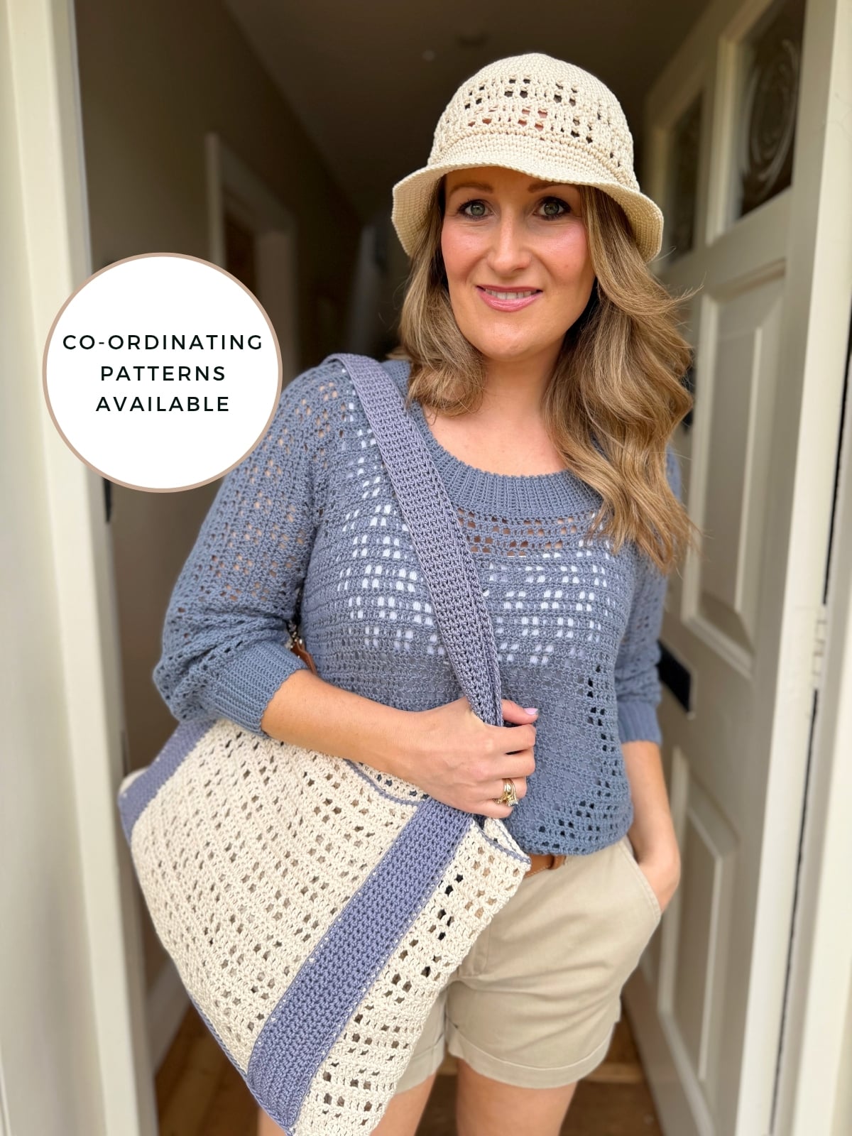Woman wearing a crocheted hat and top with beige shorts, holding a matching crocheted bag. A sign reads, "Free Crochet Sun Hat Pattern—co-ordinating patterns available.