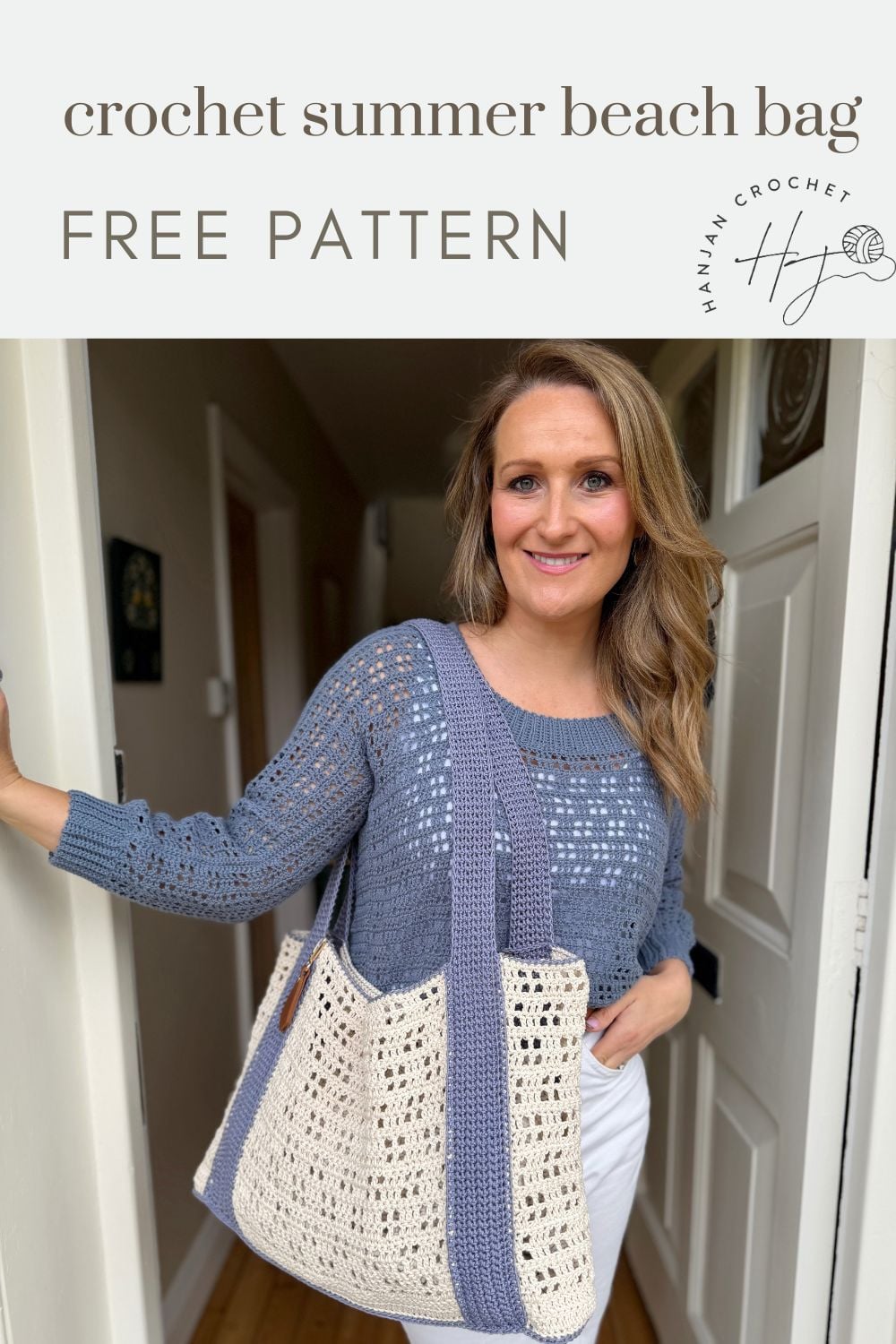 Woman wearing a blue crochet sweater holds a white and blue beach bag in a hallway. Text above reads "crochet summer beach bag FREE PATTERN"—discover this free crochet beach bag pattern for your next project!.