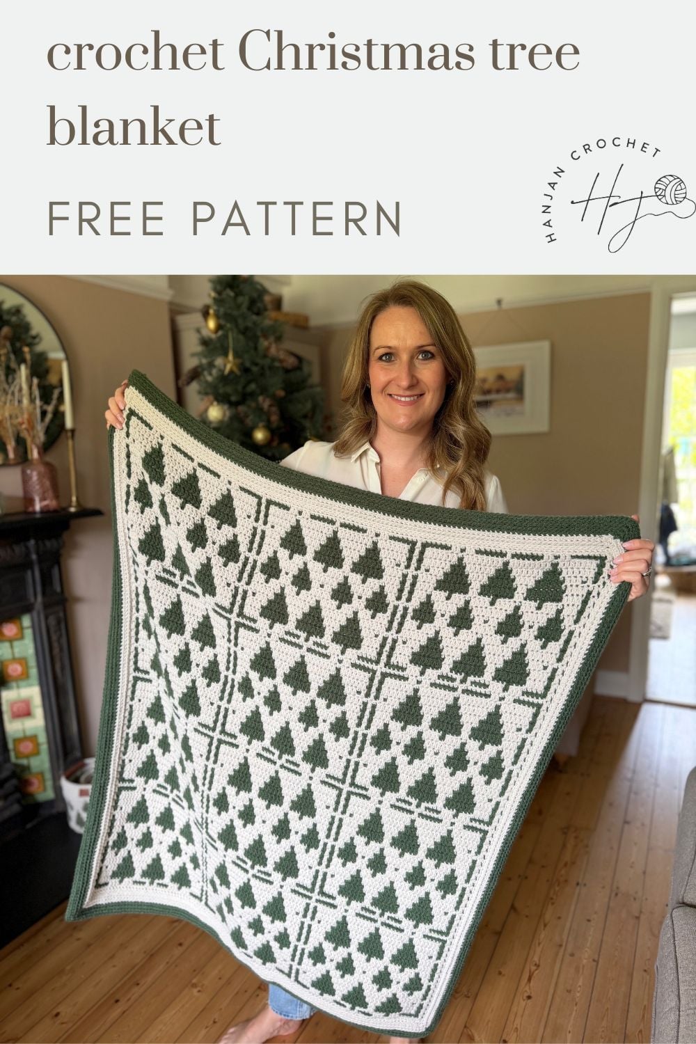 A woman stands in a living room holding a Christmas crochet afghan with a green and white tree pattern; a decorated tree is in the background. Text reads: "crochet Christmas tree blanket FREE PATTERN.