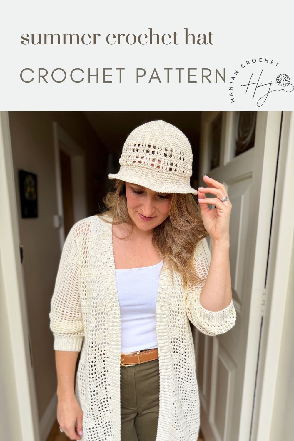Woman wearing a cream-colored crochet hat and matching cardigan, standing indoors beneath text that reads "summer crochet hat CROCHET PATTERN." Discover this stylish look with our Free Crochet Sun Hat Pattern!.