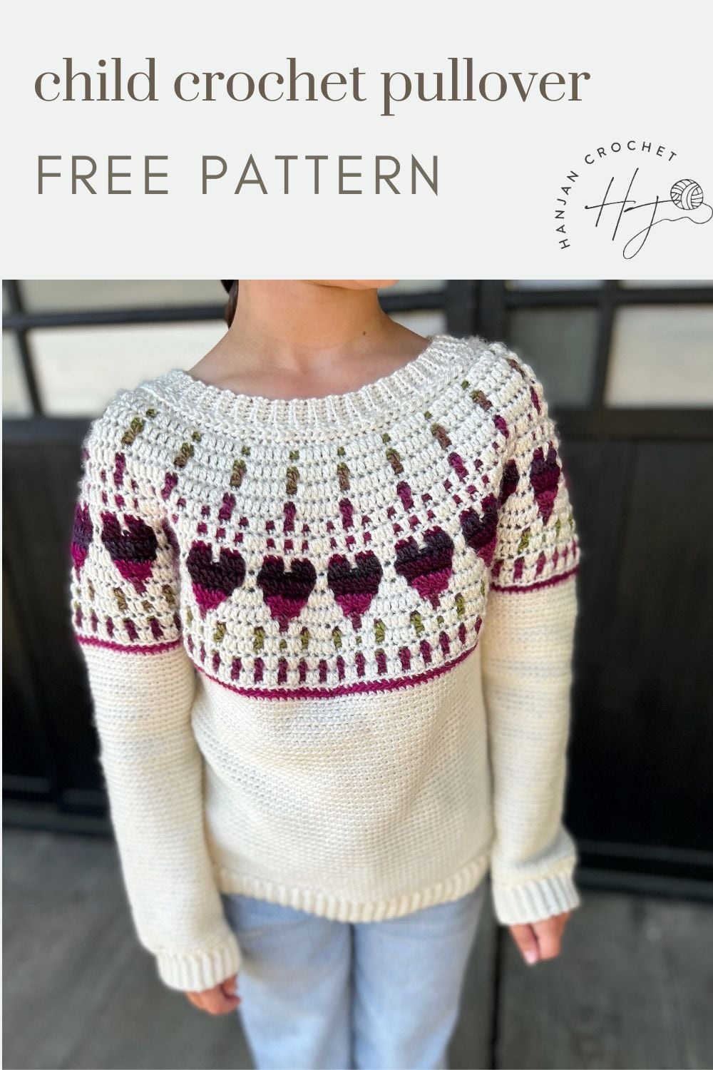 Child wearing a cream crochet pullover sweater with purple and green heart patterns; text reads “child crochet pullover free pattern.”.
