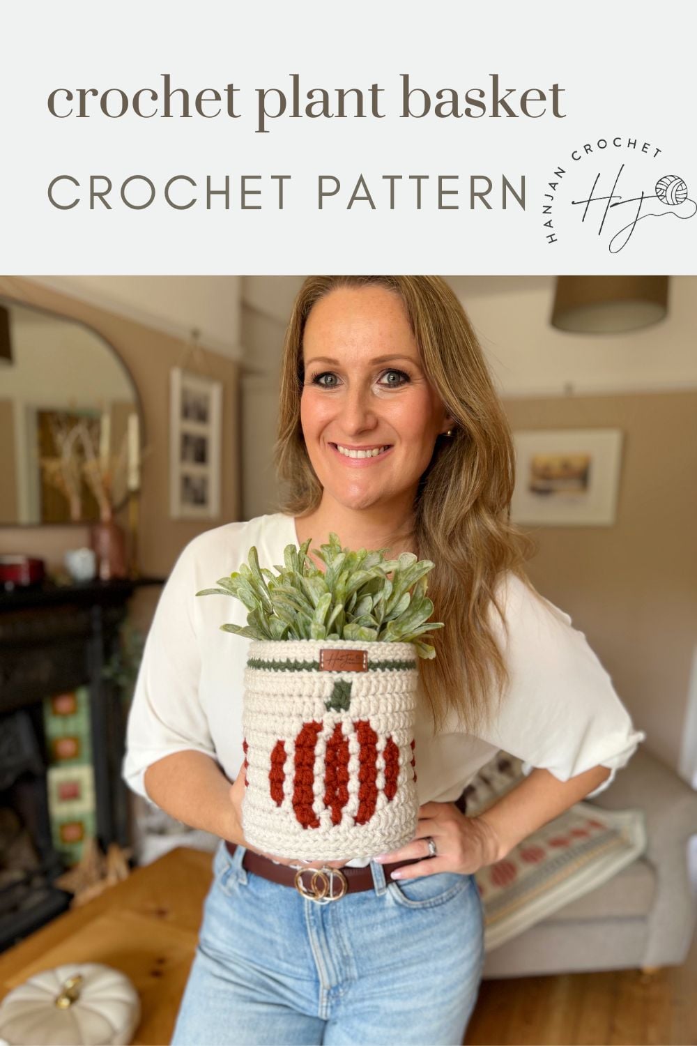 Woman holding a crochet pumpkin basket with a charming pumpkin design, standing in a cozy living room; text above reads “crochet plant basket CROCHET PATTERN.”.