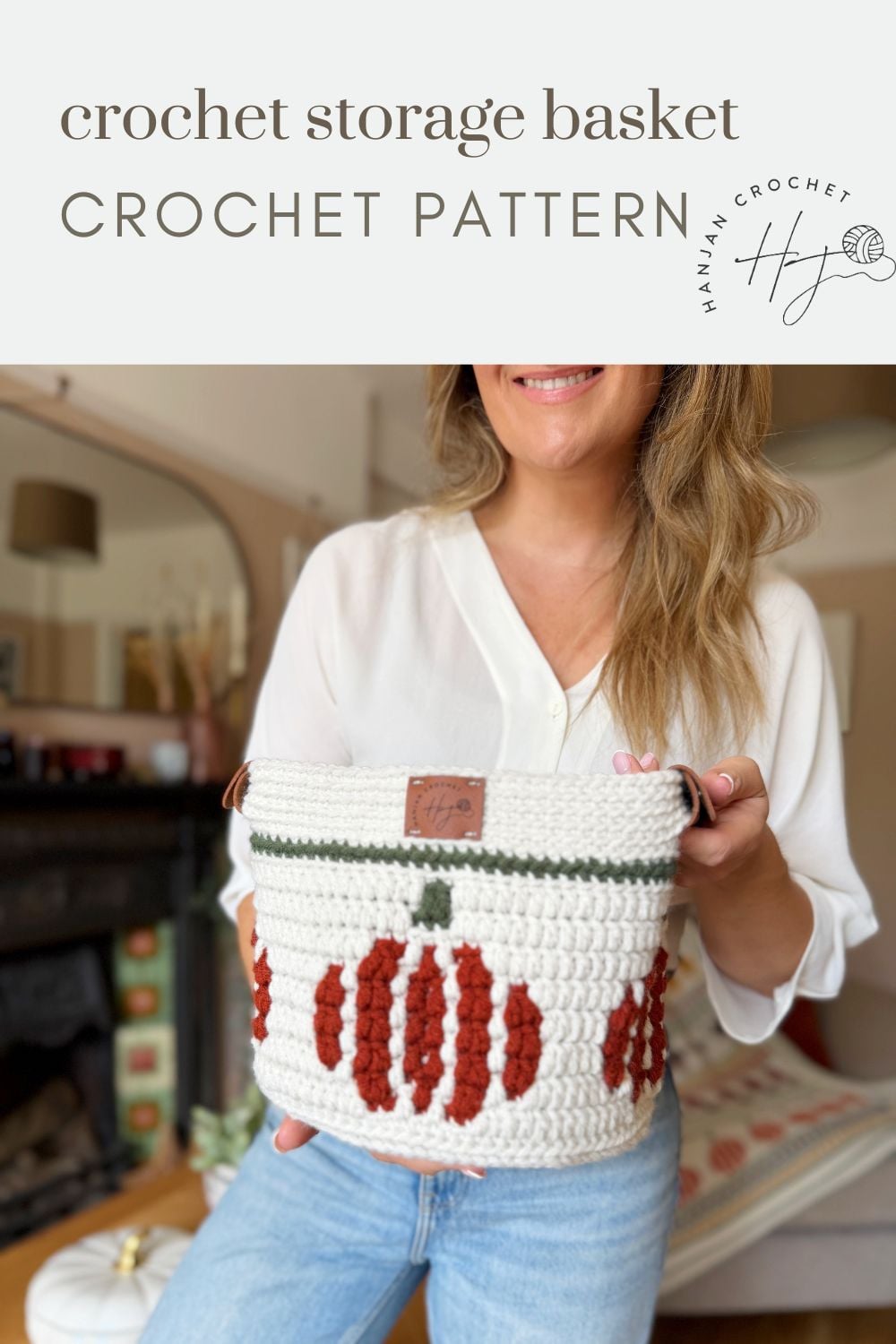 Woman holding a white crochet pumpkin basket with orange pumpkin designs; text above reads “crochet storage basket CROCHET PATTERN.”.