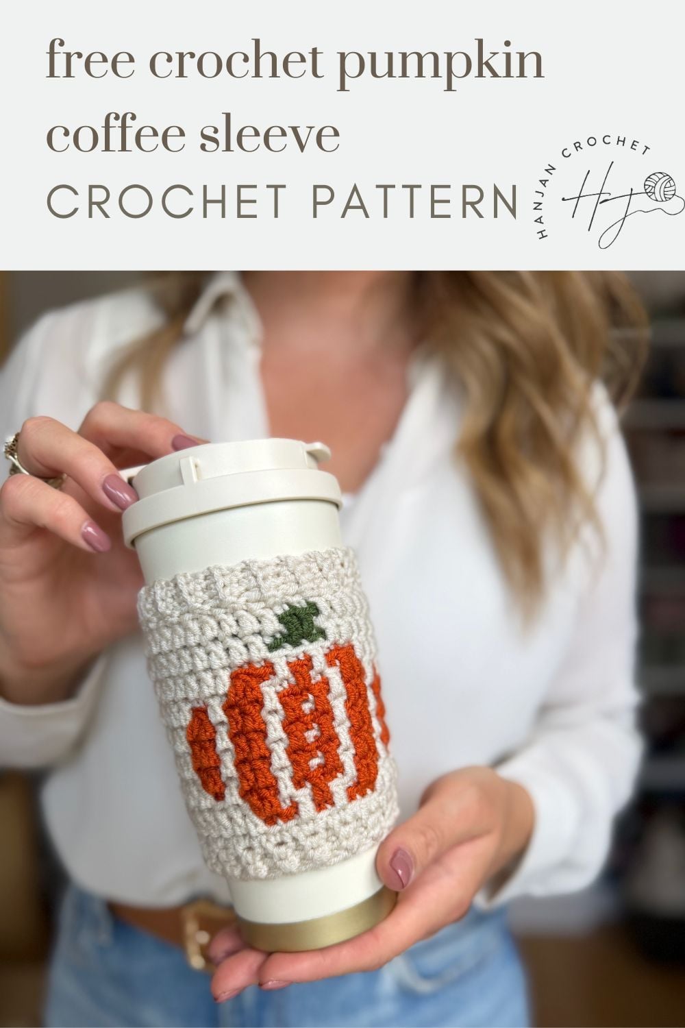 A person holds a reusable cup wrapped in a crocheted sleeve featuring an orange pumpkin design. Text above advertises a free crochet cup holder pattern for making your own pumpkin coffee sleeve.