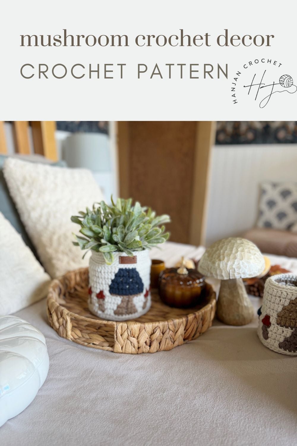 A cozy bedroom scene with crochet mushroom decor, a crochet jar cover holding a plant, and crochet mushrooms on a woven tray atop a bed, complemented by a charming crochet storage basket pattern for added organization and style.