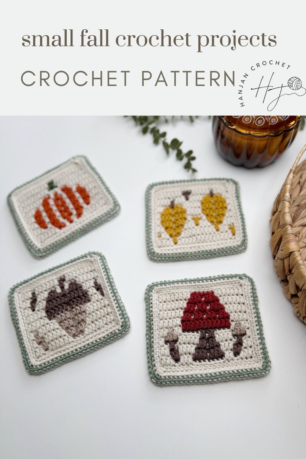 Four crocheted square coasters featuring fall themed designs: a pumpkin, two yellow leaves, an acorn, and a red mushroom, displayed on a white surface.
